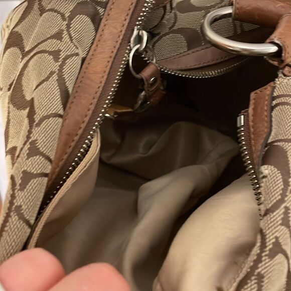 Coach woman’s brown canvas with twisted brown leather strap. - Picture 10 of 11